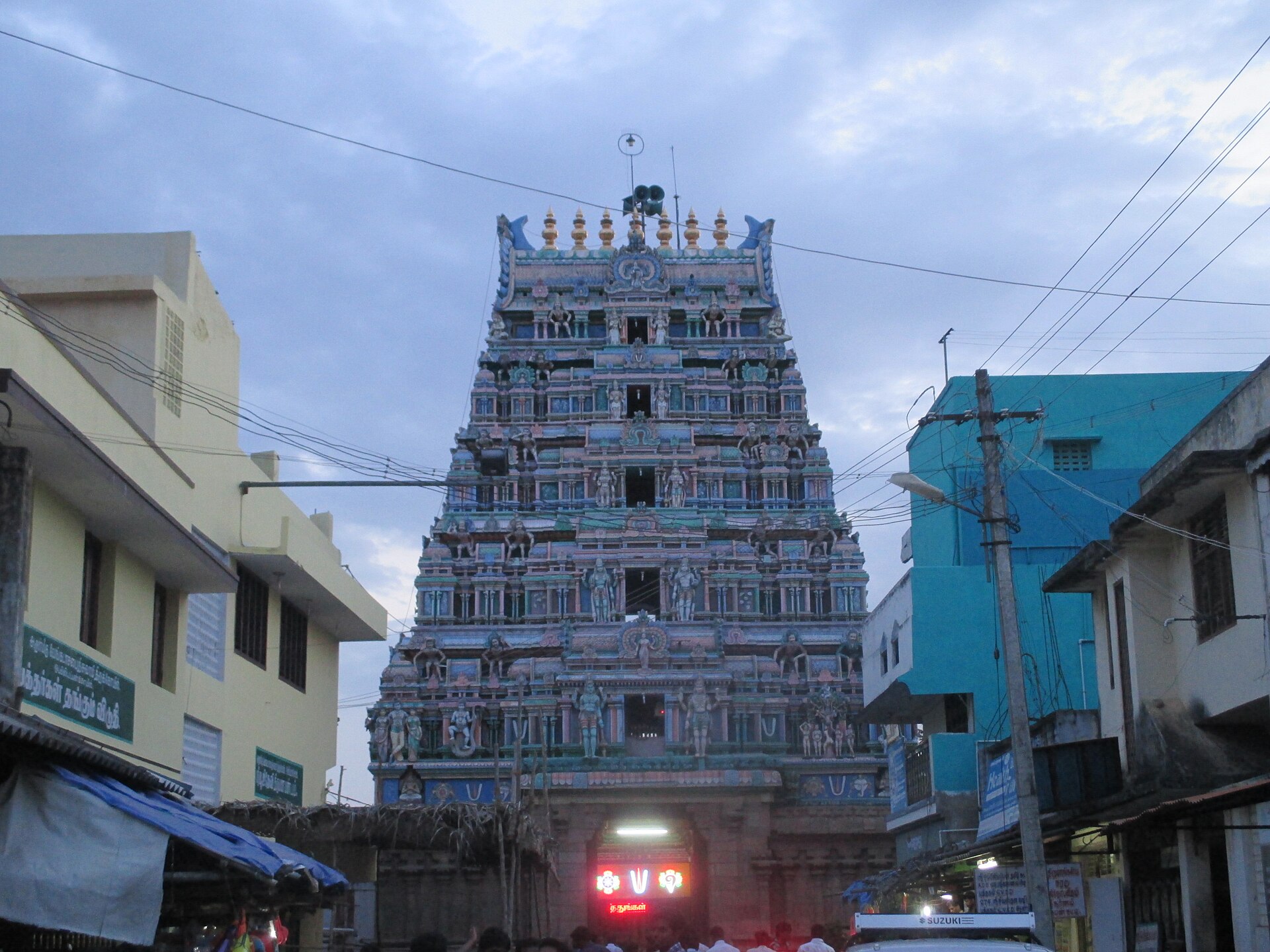 Oppiliappan Temple gopuram tower at dusk, Thiruvinnagar